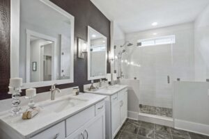 upscale white jack and jill bathroom with brown walls