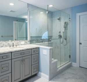 blue bathroom with glass-doored shower